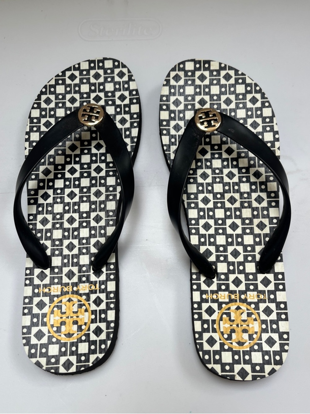 Tory Burch Black Flip Flop Sandals with Gold Logo Accents